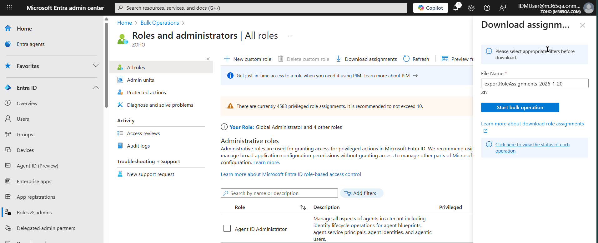 The Microsoft Entra admin center showing the Roles and administrators page with the Download assignments pane to download the list of admins.