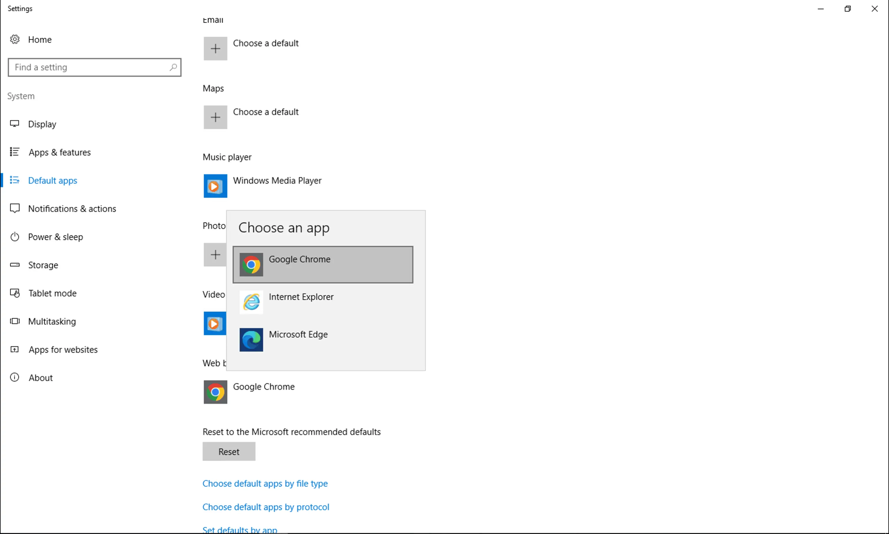 The Settings app on the Default apps page, showing the Choose an app dialog.